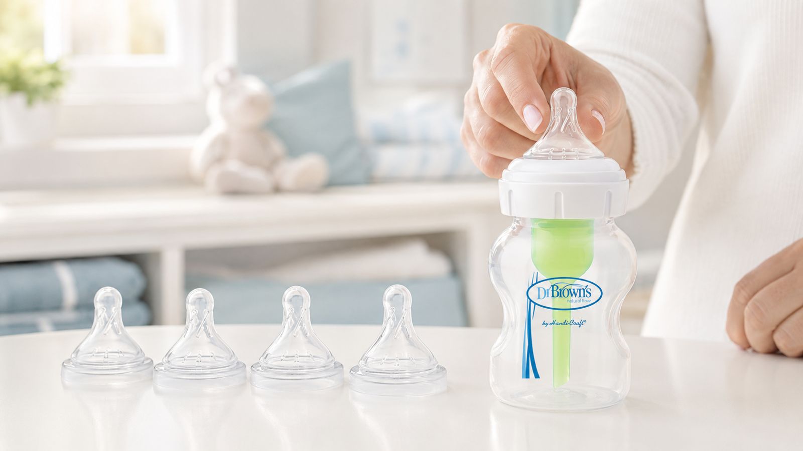 Dr Brown's  Baby bottle on the table with different teat levels