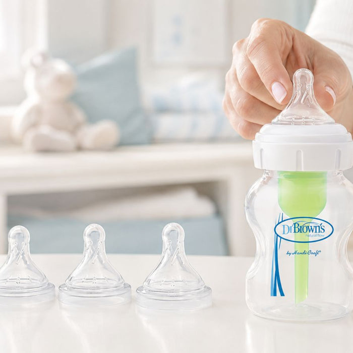 Dr Brown's  Baby bottle on the table with different teat levels