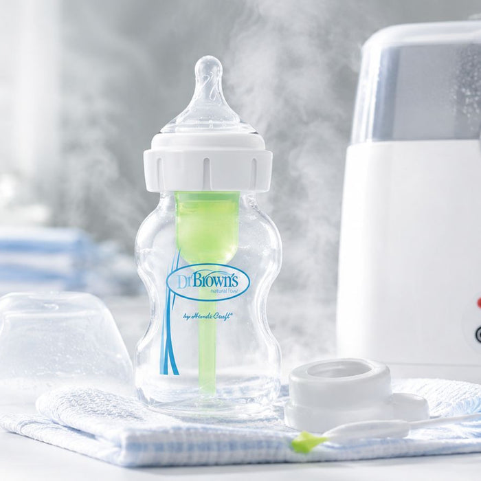 Dr Brown's bottle with a sterilizer sitting on the kitchen counter